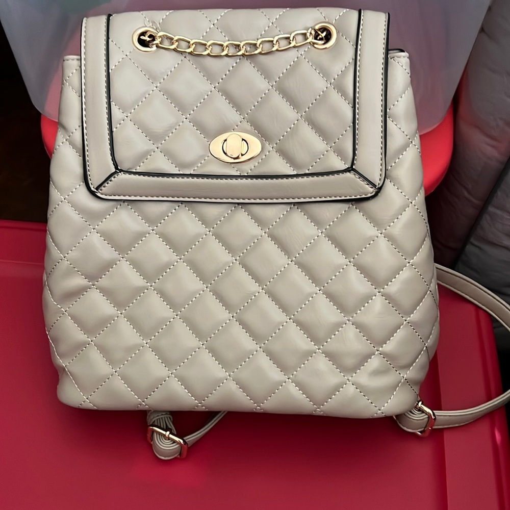Medium size back pack beige color gold hardware